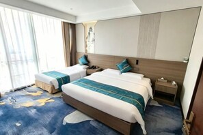 A hotel room with two beds, a large window, and a view of the cityscape. - Handan Zhaowang Hotel (Handan)
