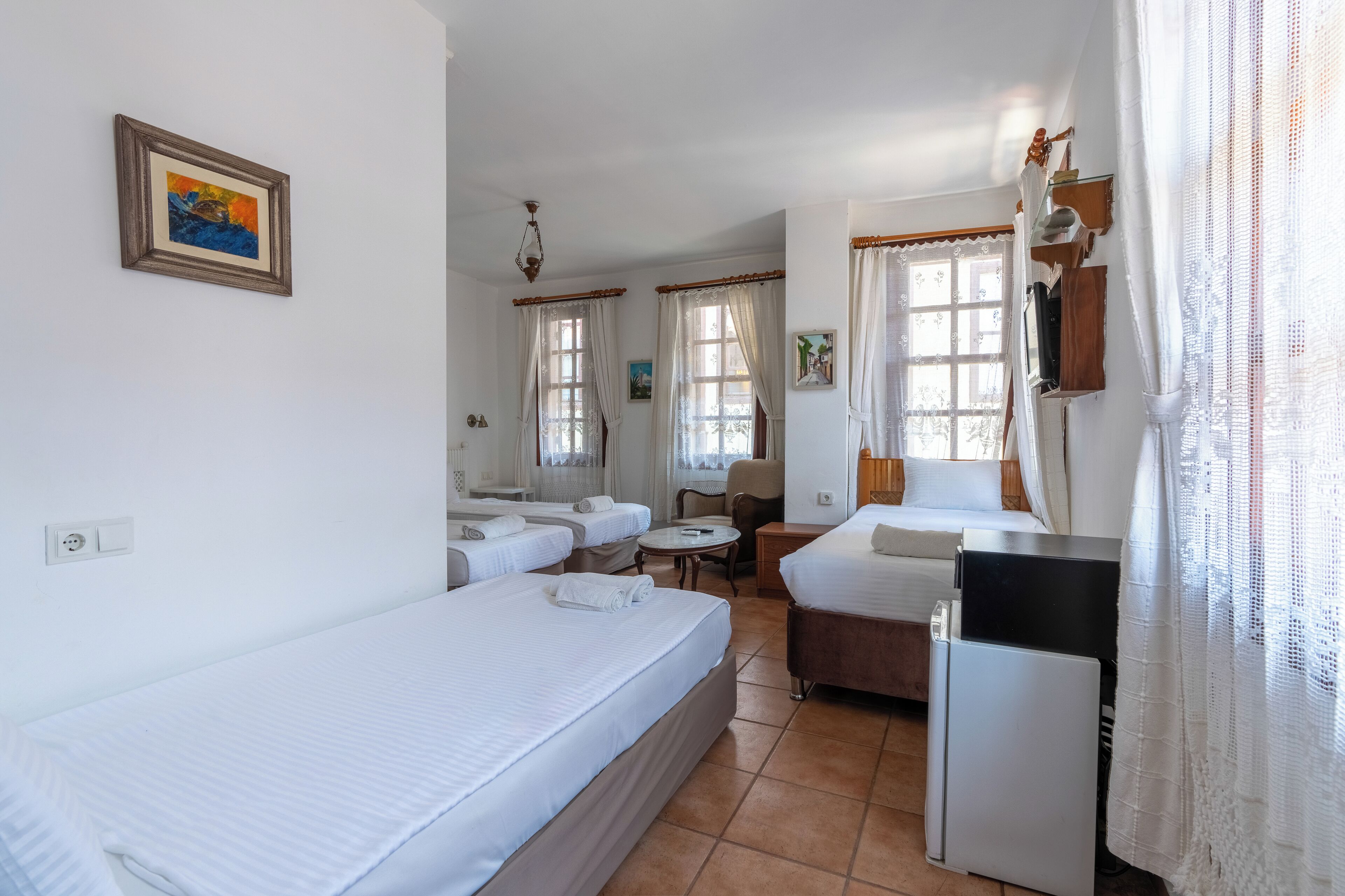 quadruple room | 1 bedroom, minibar, in-room safe, iron/ironing board