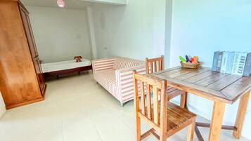 Apartment, 1 Bedroom, Ocean View | Living area | 34-cm flat-screen TV with satellite channels, TV