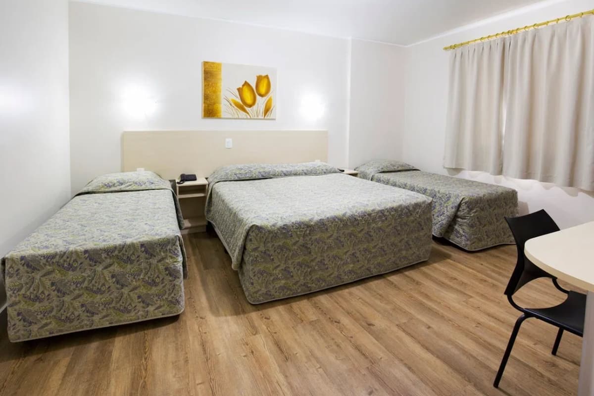 Quadruple Room | Minibar, in-room safe, blackout drapes, iron/ironing board