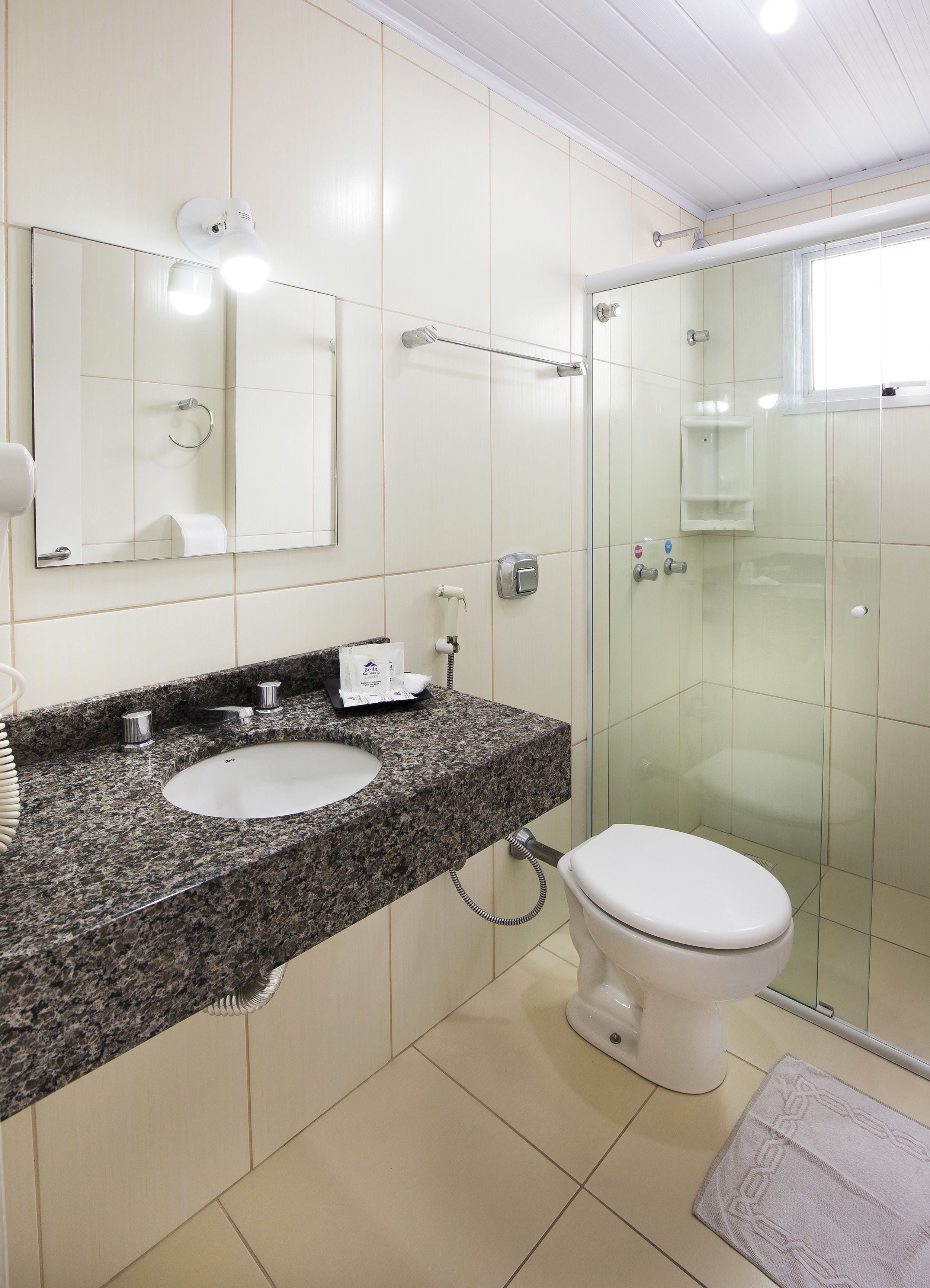 single room | bathroom | shower, hair dryer, towels, soap