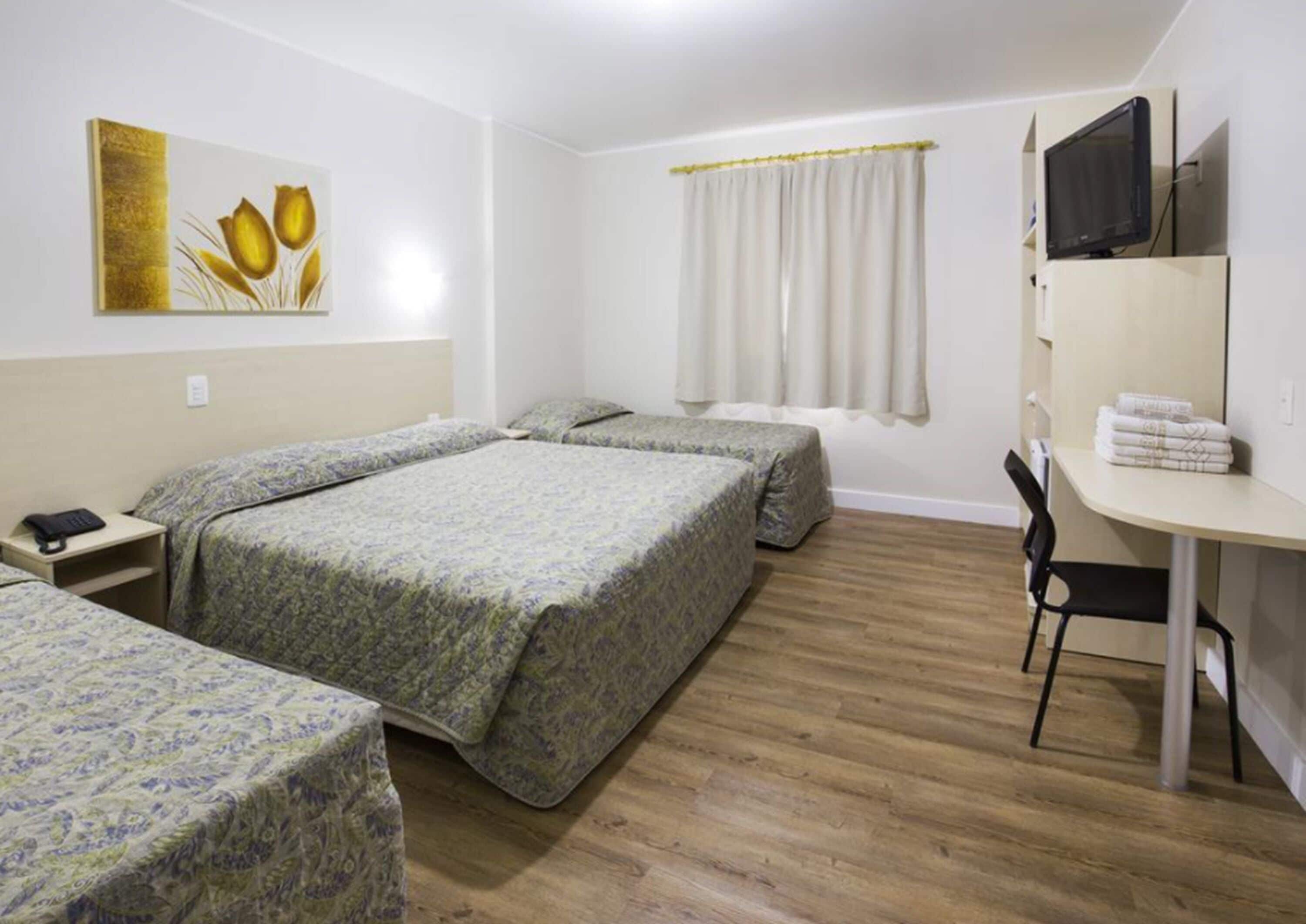 quadruple room | minibar, in-room safe, blackout curtains, iron/ironing board