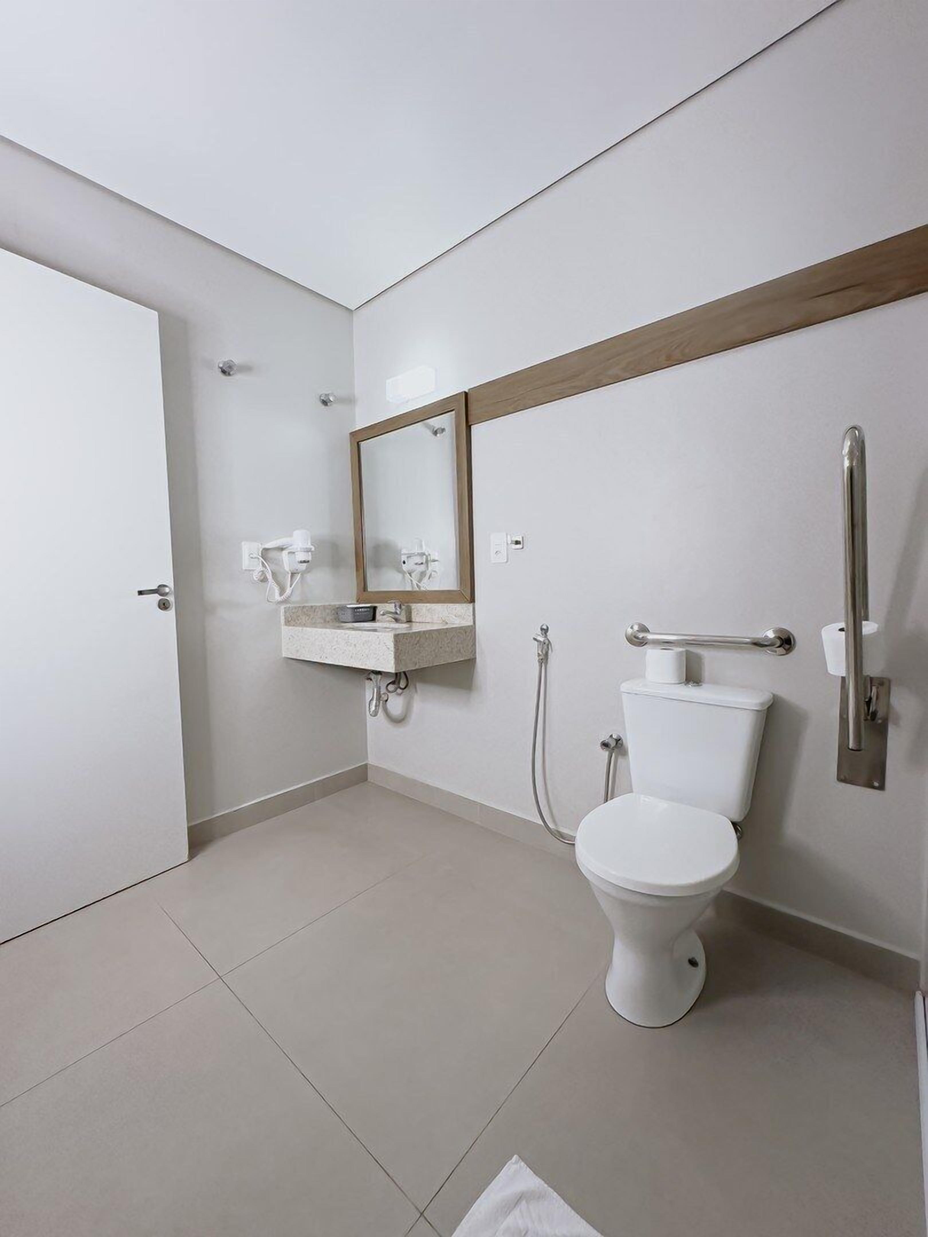 quadruple room, mobility accessible | bathroom | shower, hair dryer, towels, soap