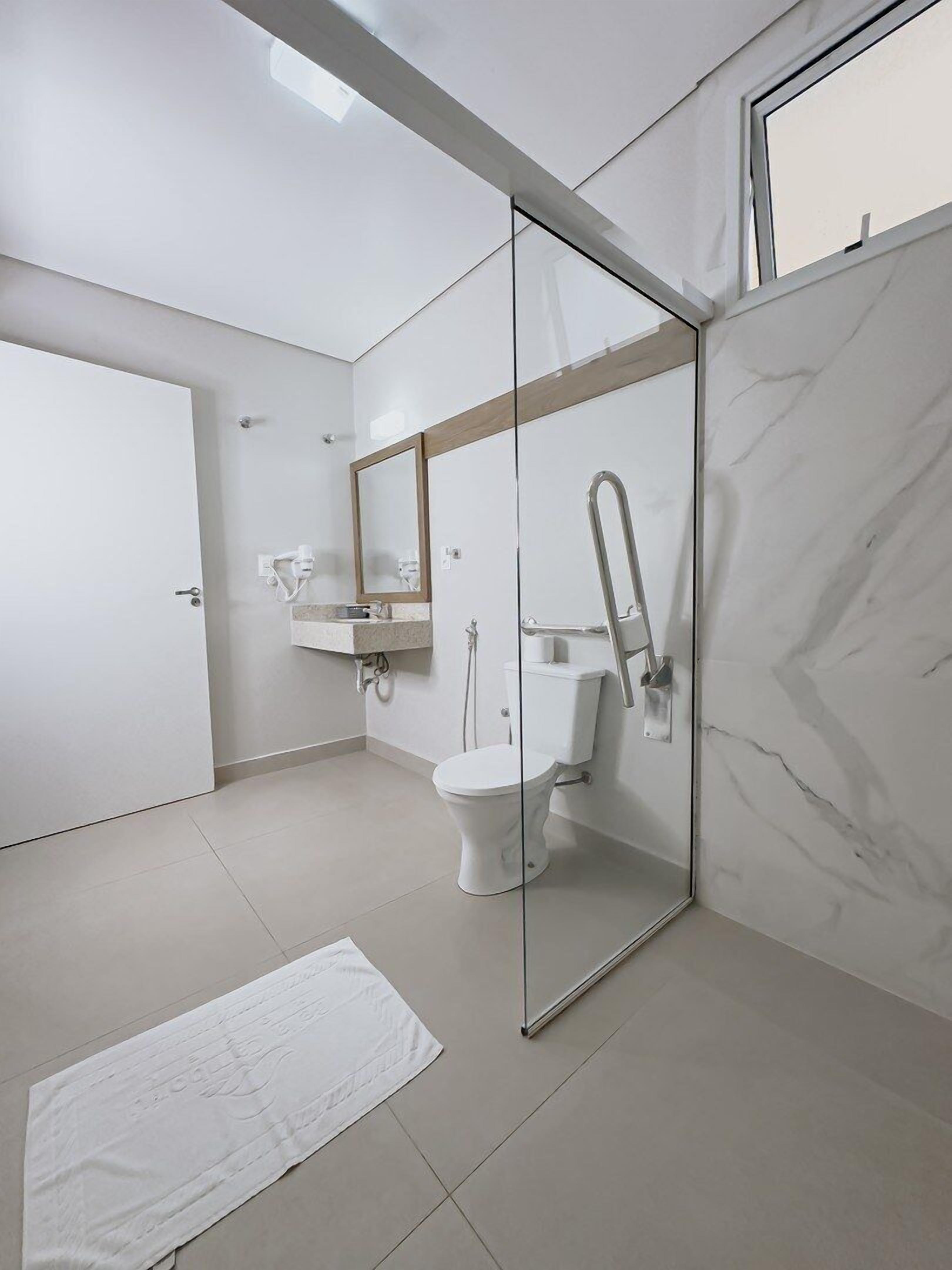 quadruple room, mobility accessible | bathroom | shower, hair dryer, towels, soap