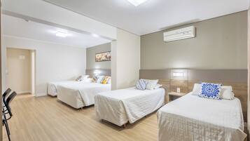 Family Room | Minibar, in-room safe, blackout drapes, iron/ironing board