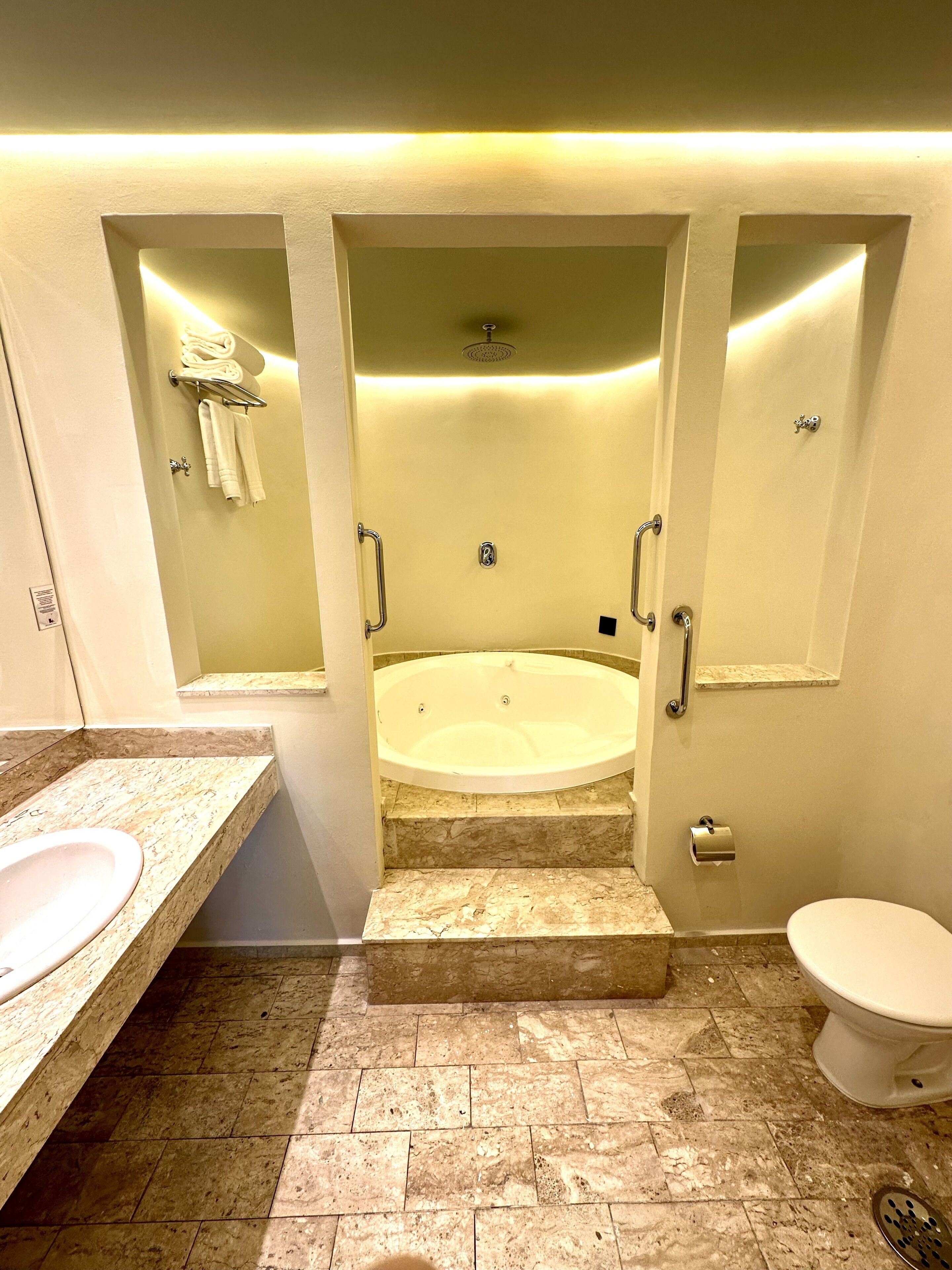 presidential suite, 1 king bed, non smoking, jetted tub | bathroom | hair dryer, towels, soap, shampoo