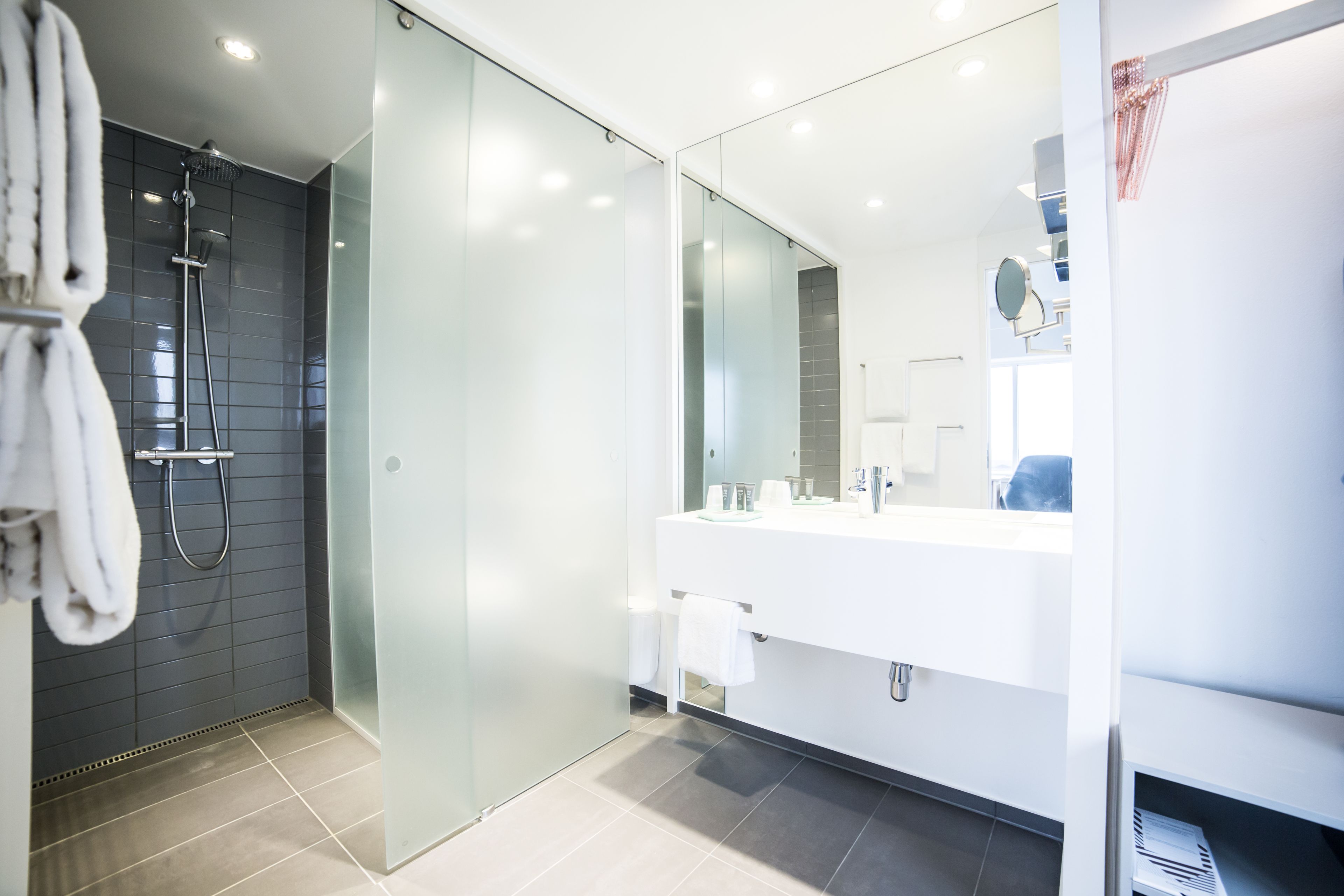 shower, eco-friendly toiletries, hair dryer, towels