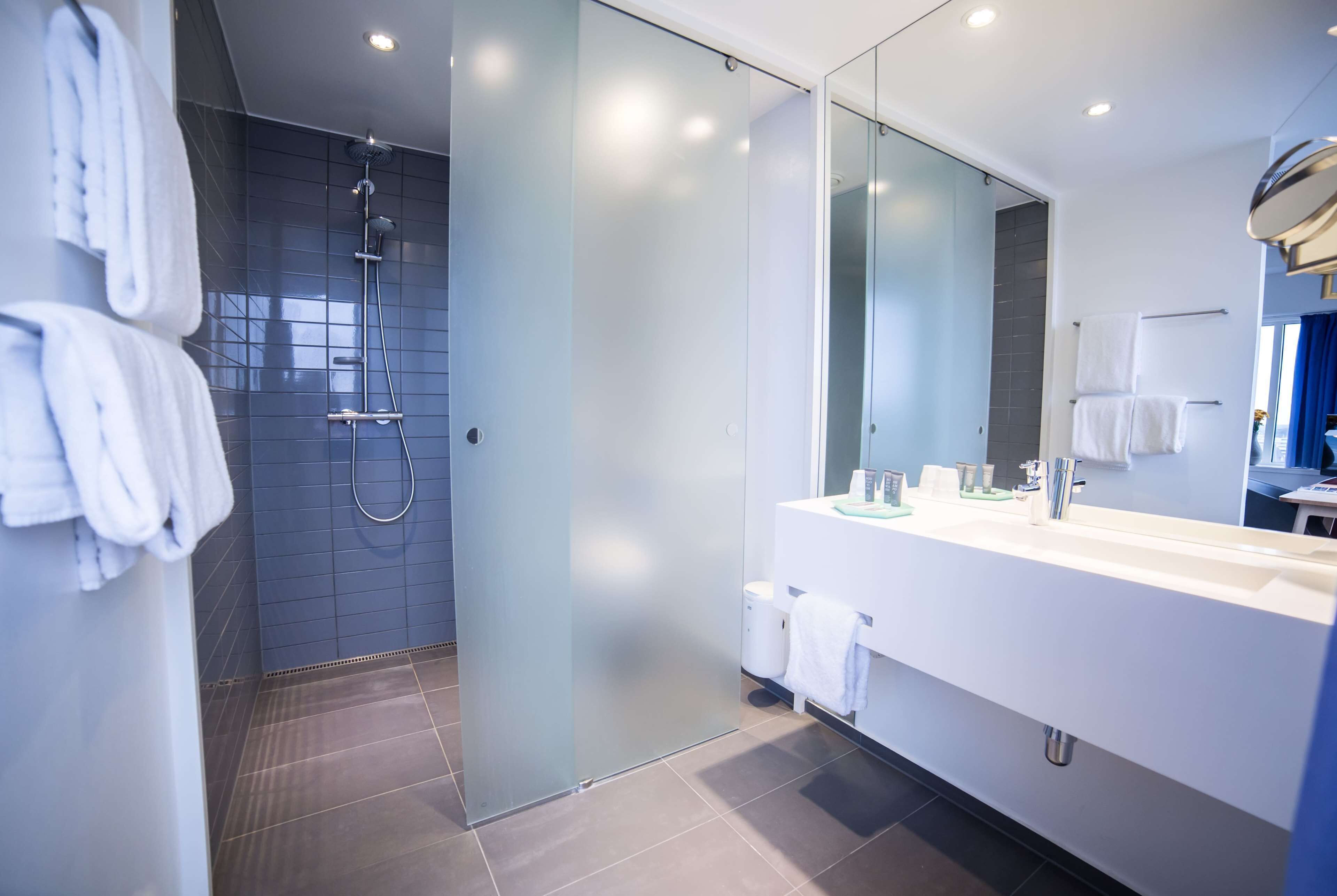 shower, eco-friendly toiletries, hair dryer, towels