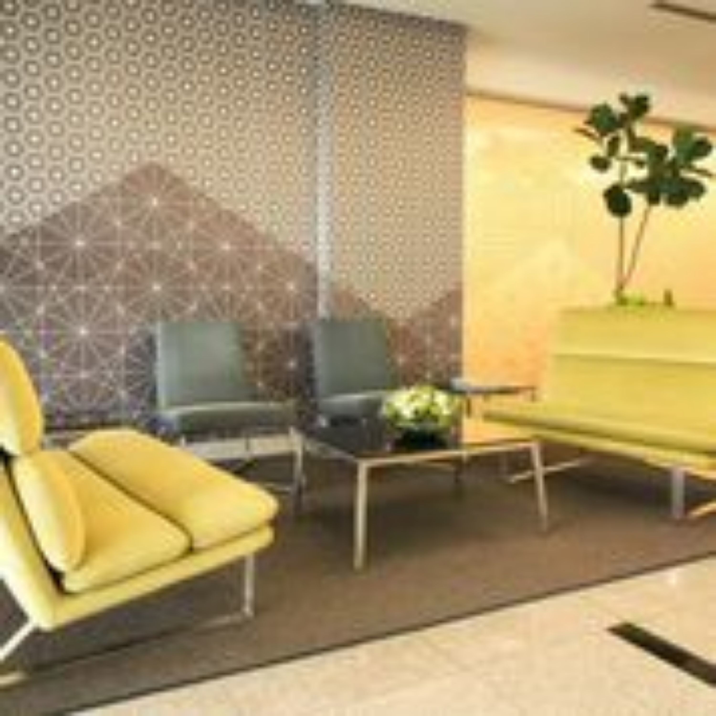 A modern interior with a yellow sofa, two armchairs, a coffee table, and a decorative wall with geometric patterns.