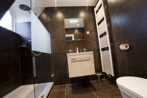 Junior Suite | Bathroom | Rainfall showerhead, designer toiletries, hair dryer, dressing gowns