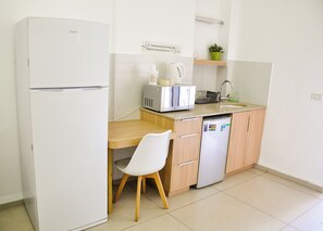 Fridge, microwave, electric kettle, cookware/dishes/utensils