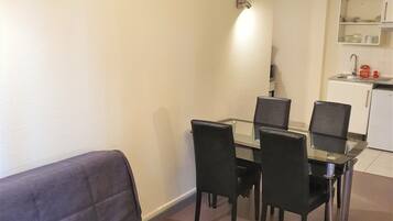 Apartment, 1 Bedroom | Living area | Flat-screen TV