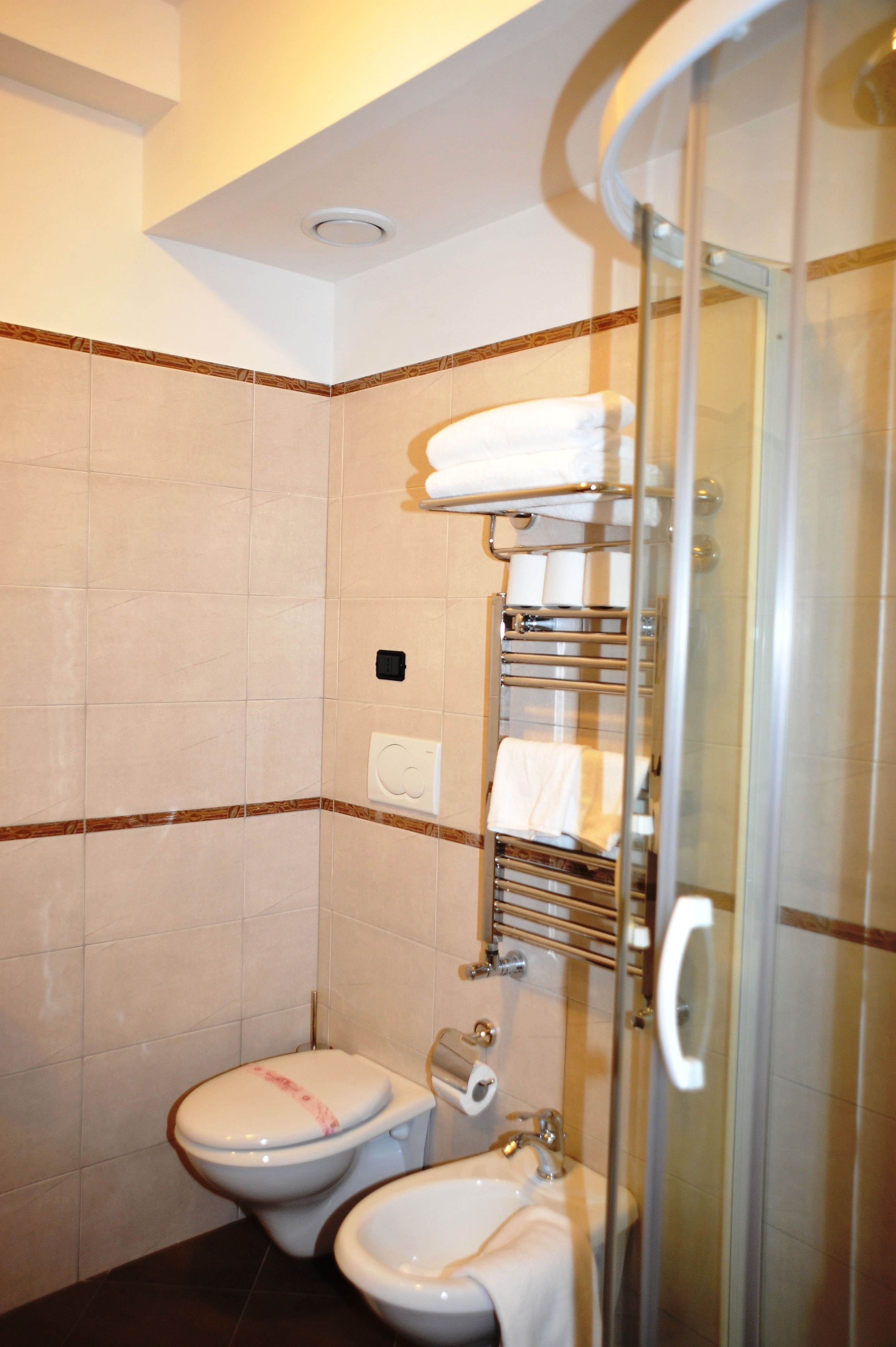 deluxe double room | bathroom | rainfall showerhead, free toiletries, hair dryer, bidet
