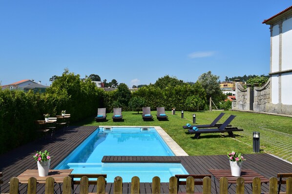 Outdoor pool, pool umbrellas, pool loungers