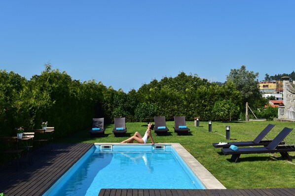 Outdoor pool, pool umbrellas, pool loungers