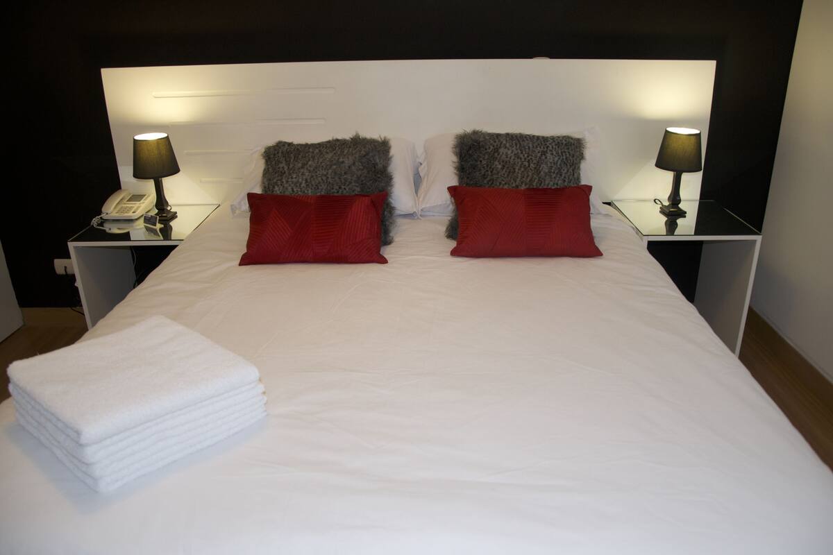 Apartment, 1 Bedroom | Down comforters, in-room safe, individually decorated