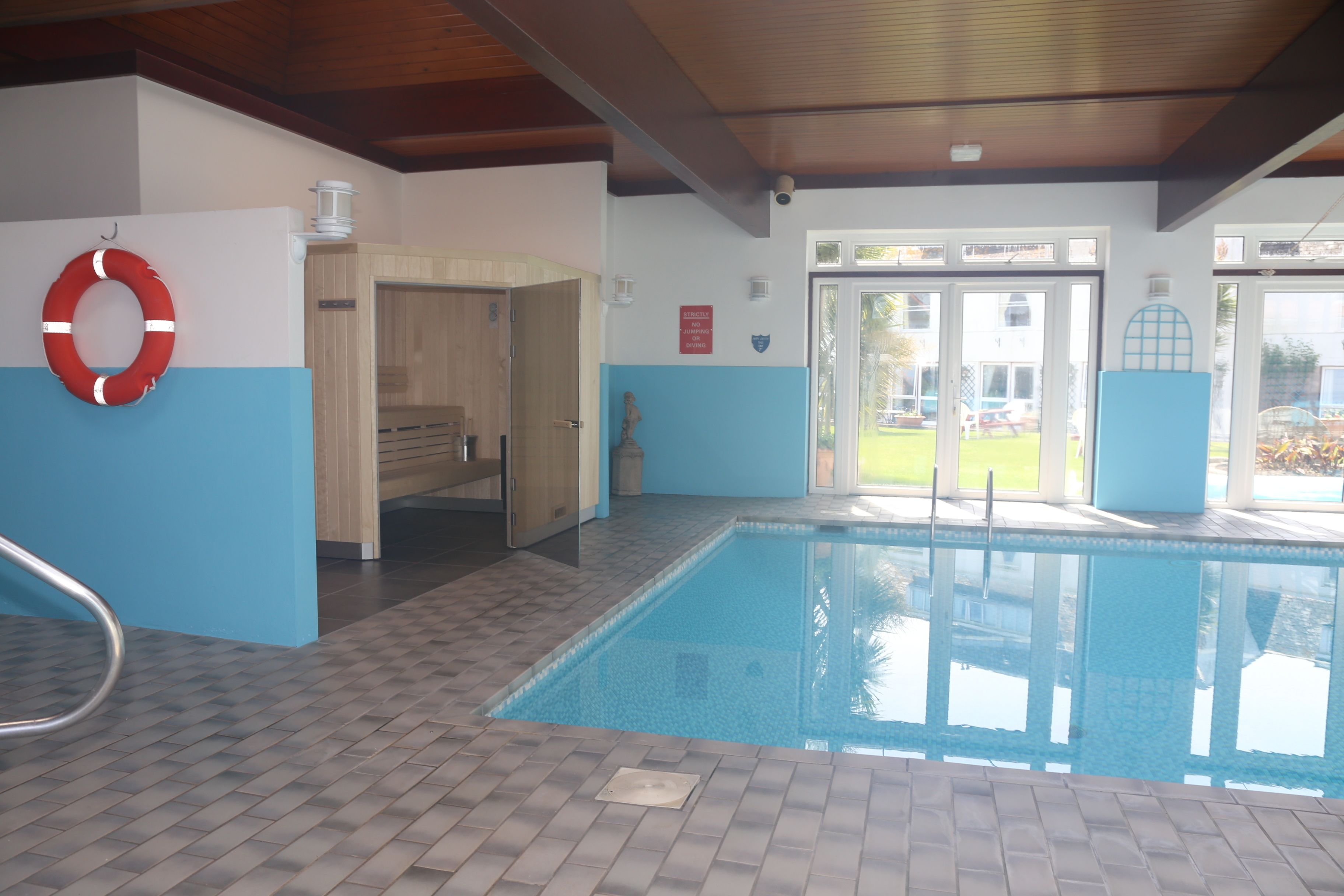 indoor pool, open 8:00 am to 8:00 pm, pool loungers
