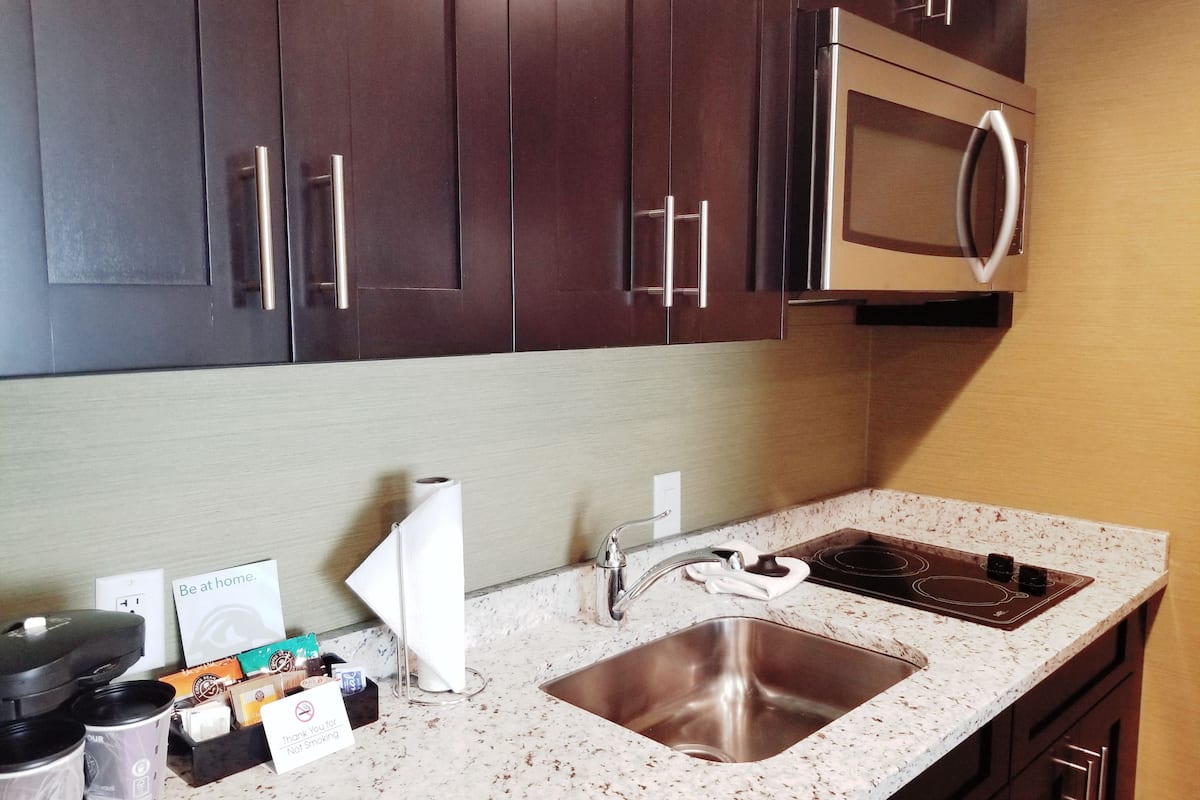 full-sized fridge, microwave, stovetop, dishwasher