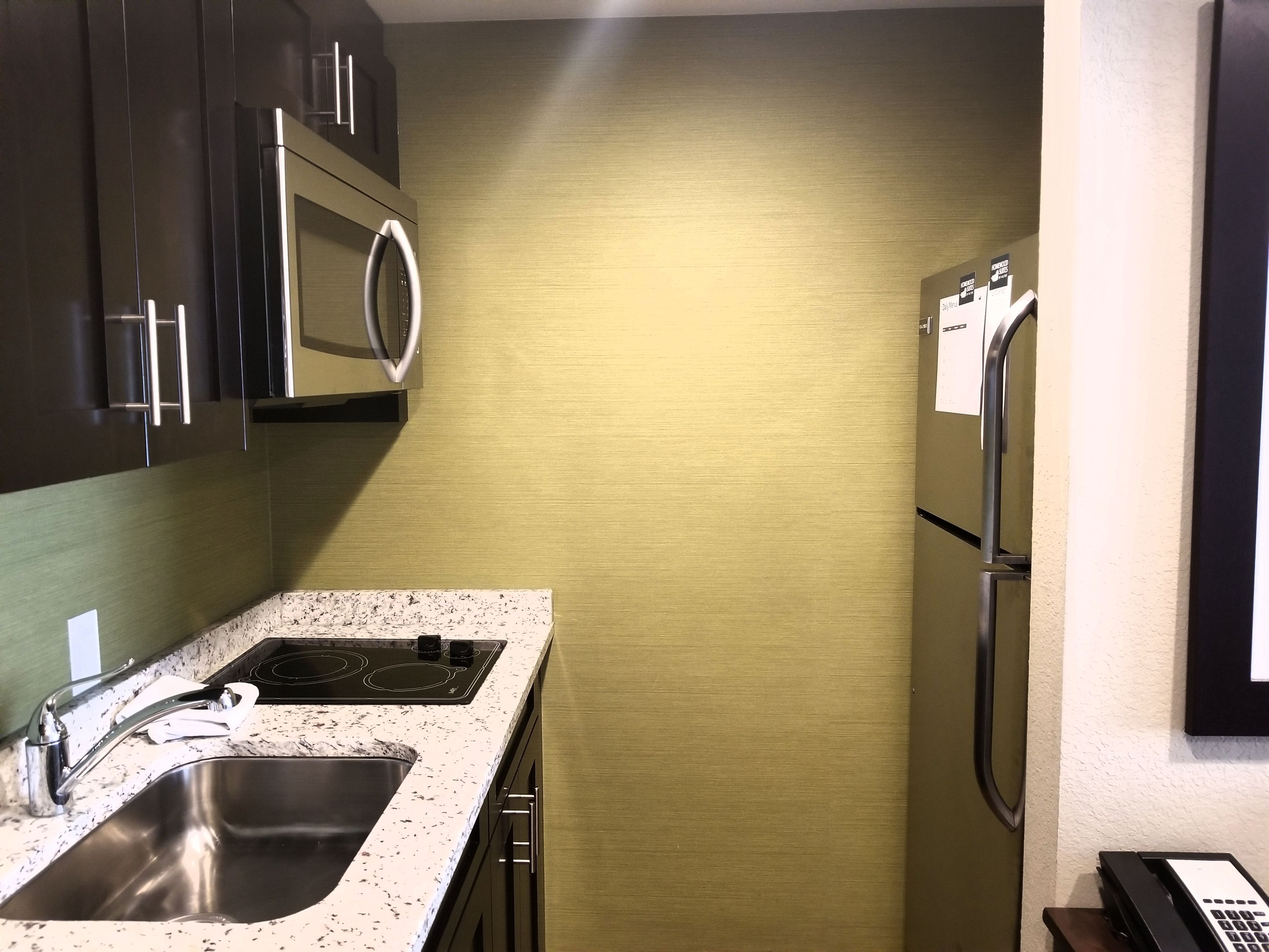 full-sized fridge, microwave, stovetop, dishwasher