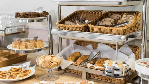A buffet setup with various baked goods and desserts. - Hotel Bernardino (Lucca)