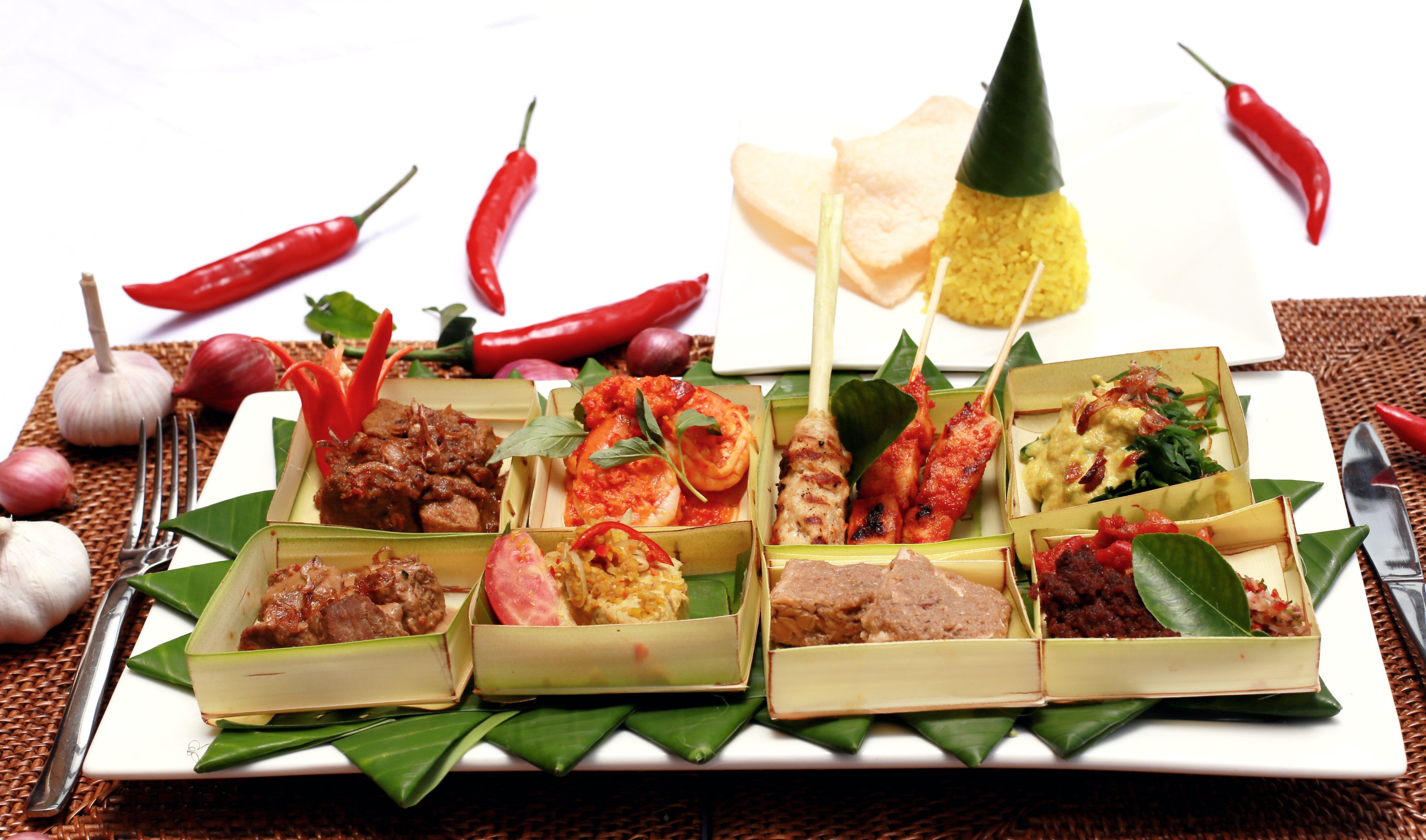 A variety of food items arranged on a table with a white background.