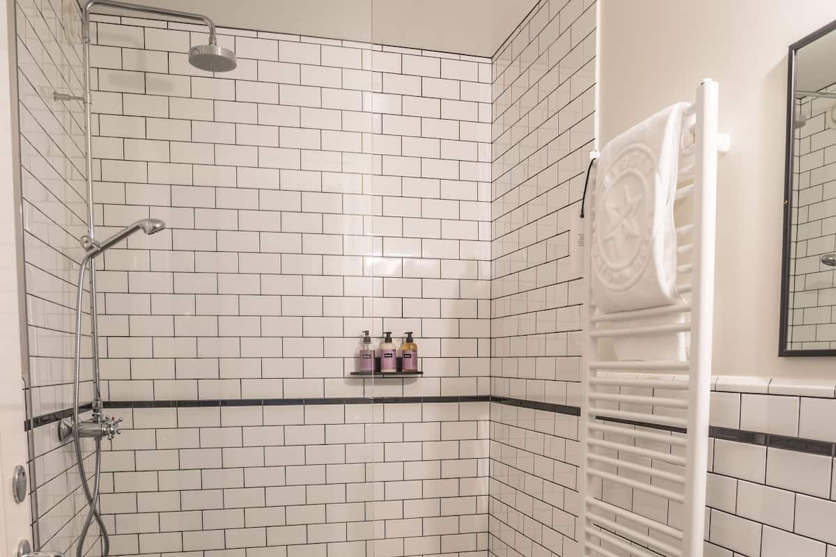 big room with kitchenette | bathroom | shower, rainfall showerhead, designer toiletries, hair dryer