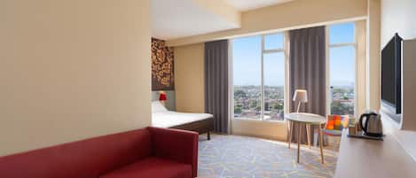 Habitación Deluxe, 1 cama King size | Ropa de cama de alta calidad y minibar