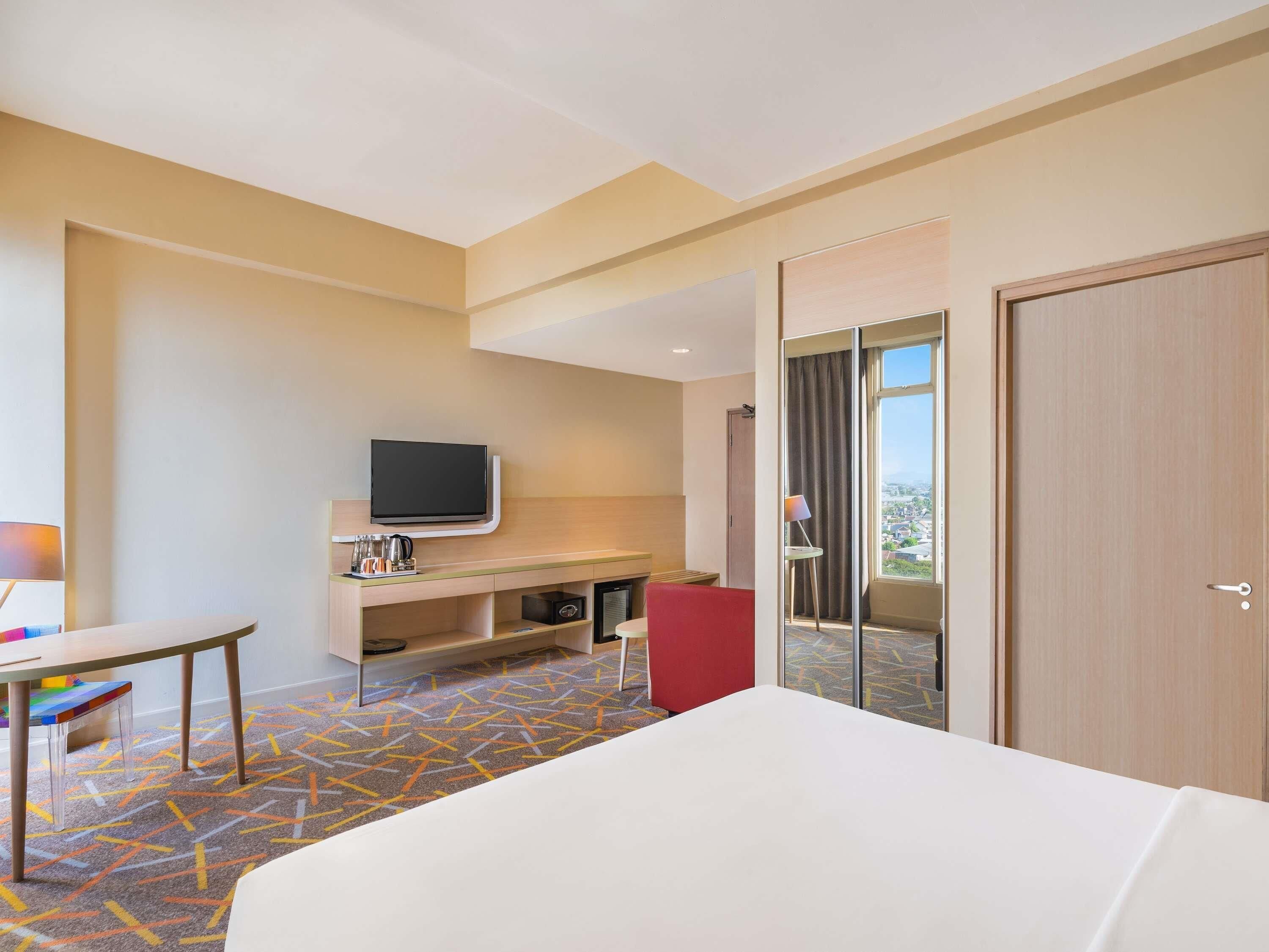 Habitación Deluxe, 1 cama King size | Ropa de cama de alta calidad y minibar 