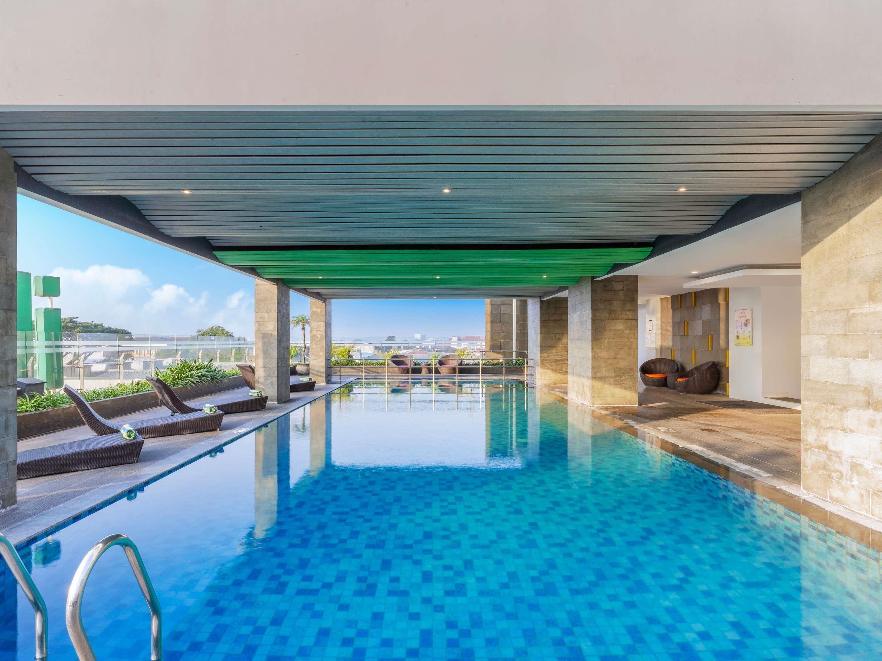 Indoor pool, open 9:00 AM to 5:00 PM, pool loungers