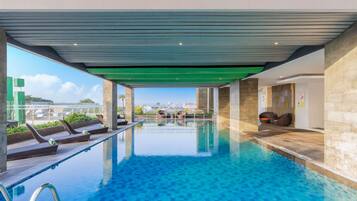 Indoor pool, open 9:00 AM to 5:00 PM, pool loungers
