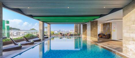 Indoor pool, open 9:00 AM to 5:00 PM, pool loungers