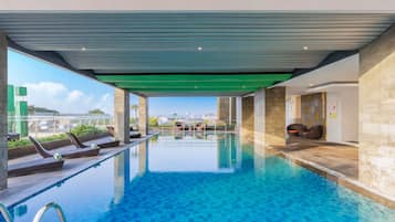 Indoor pool, open 9:00 AM to 5:00 PM, pool loungers