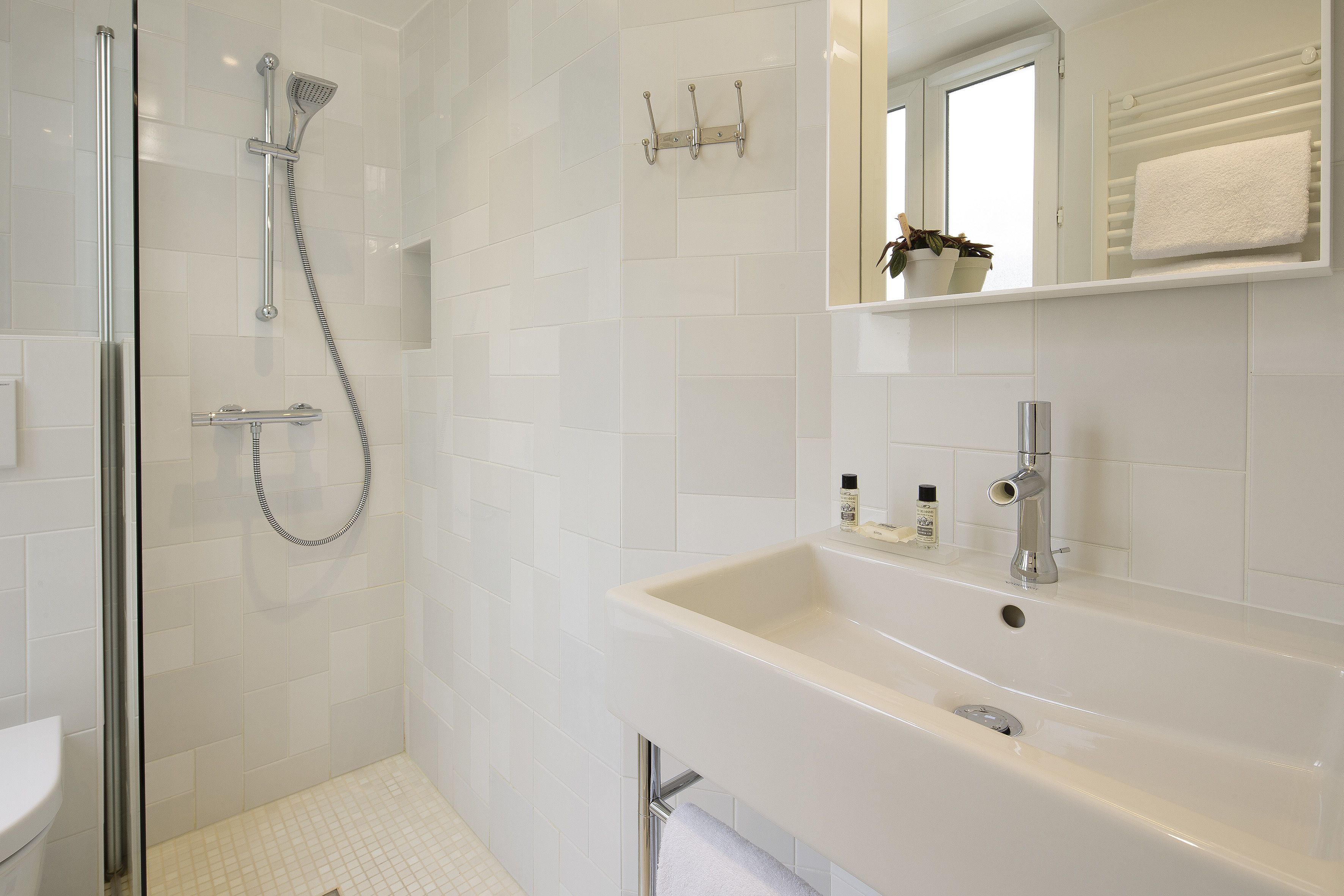 shower, eco-friendly toiletries, hair dryer, towels