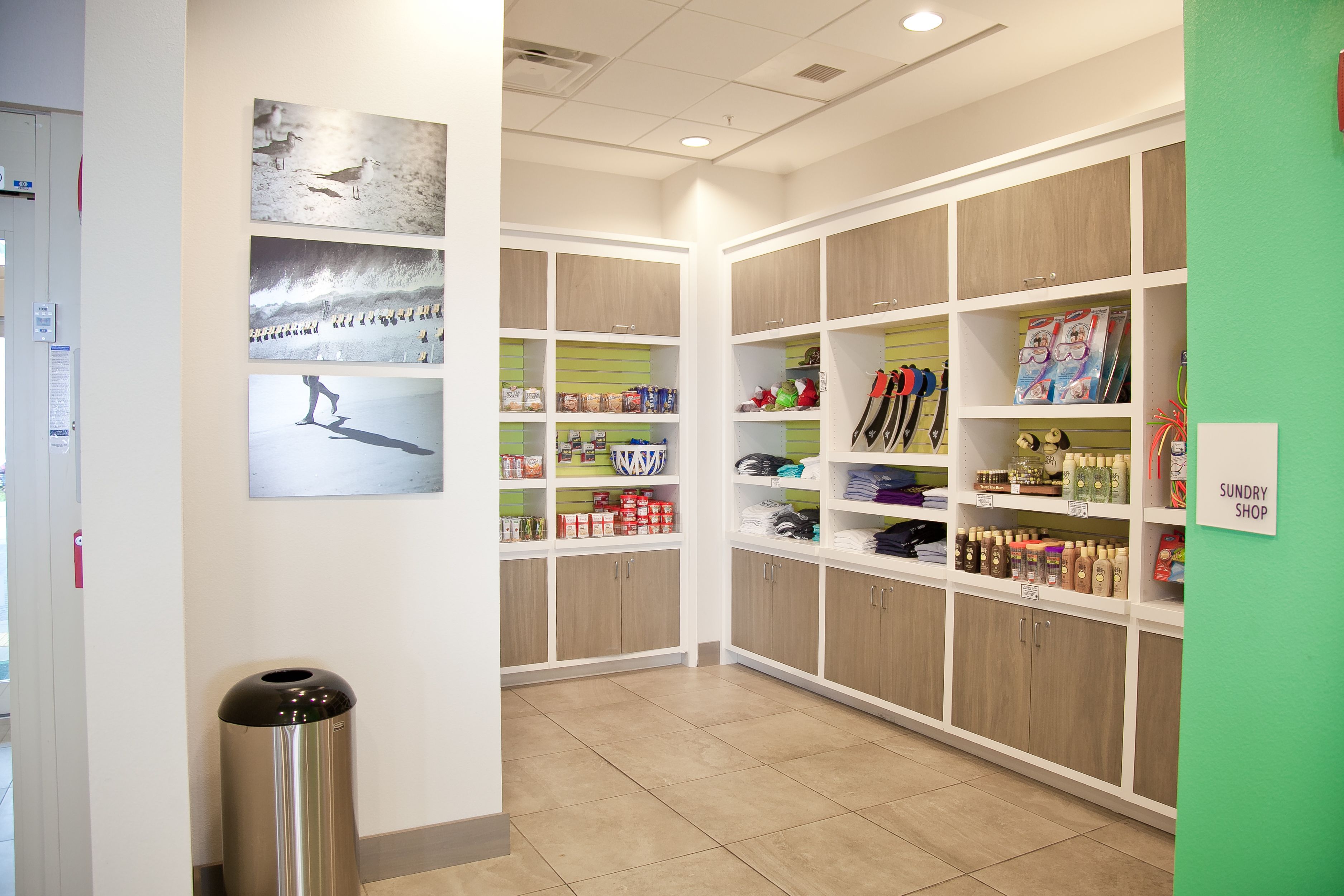 A clean, well-organized retail area with shelves stocked with various products, including snacks and beverages.