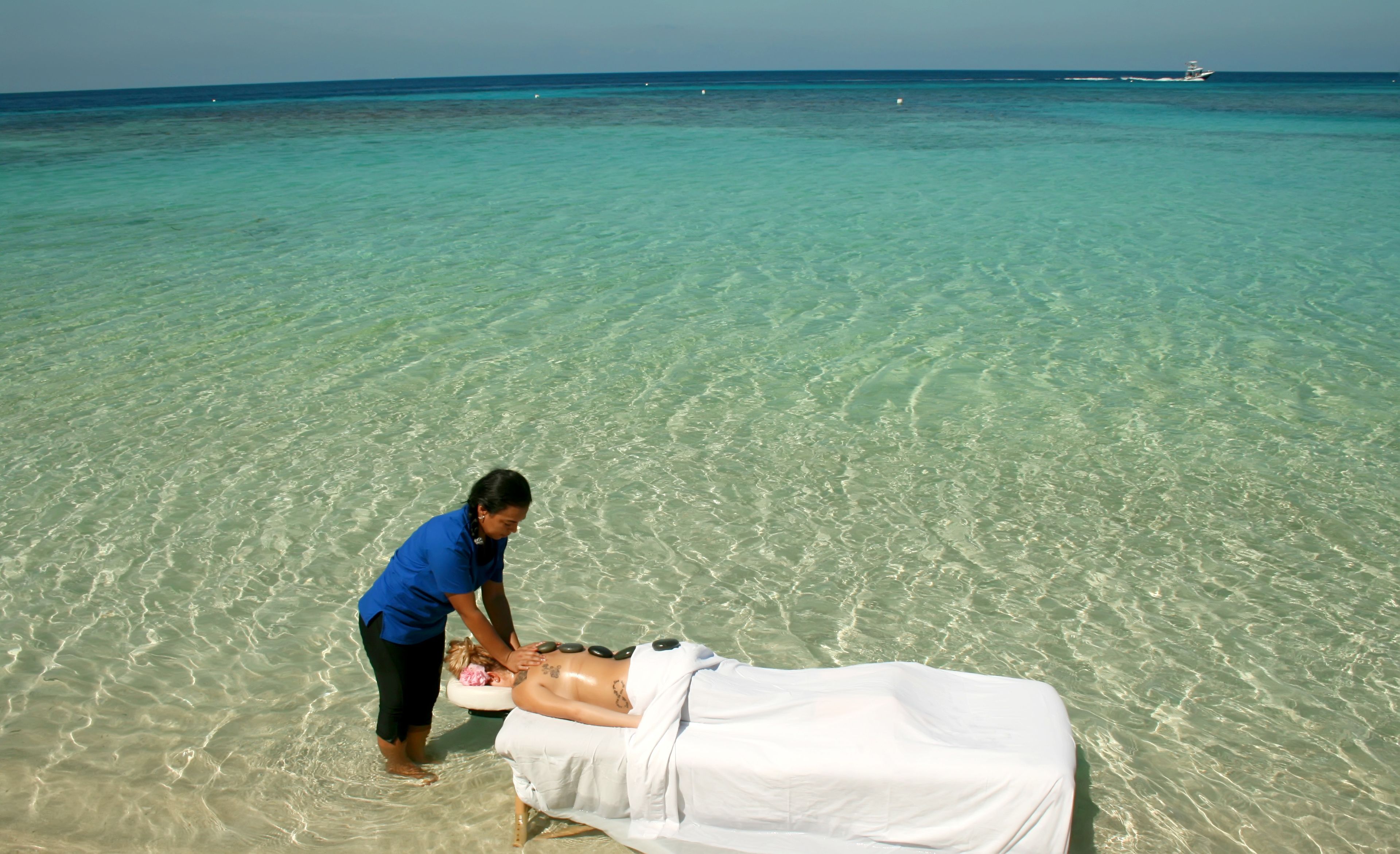 On the beach, white sand, sun-loungers, beach umbrellas