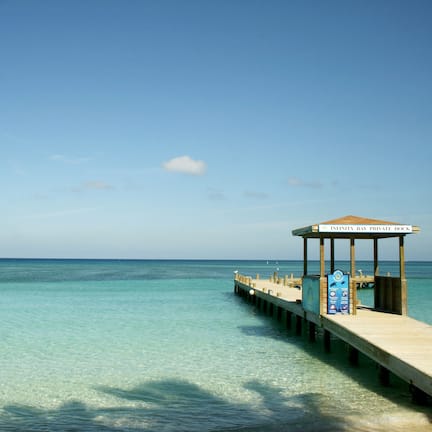 On the beach, white sand, sun loungers, beach umbrellas