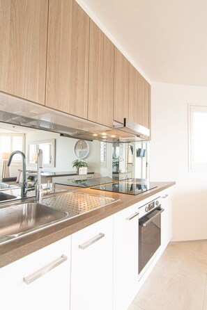 Superior Apartment | Private kitchen | Full-size fridge, microwave, stovetop, electric kettle