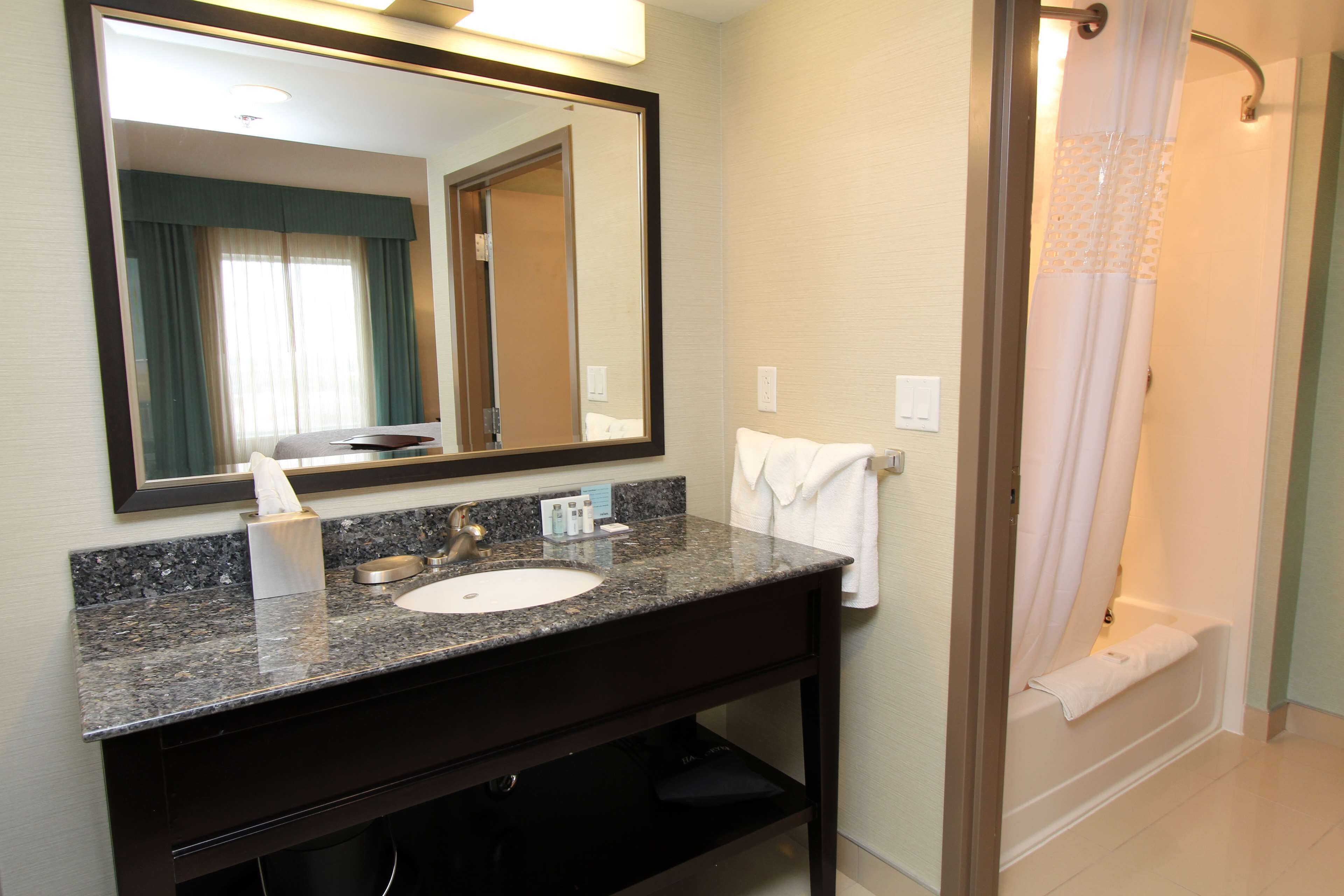 Studio Suite, 1 King Bed | Bathroom | Combined shower/bathtub, hair dryer, towels