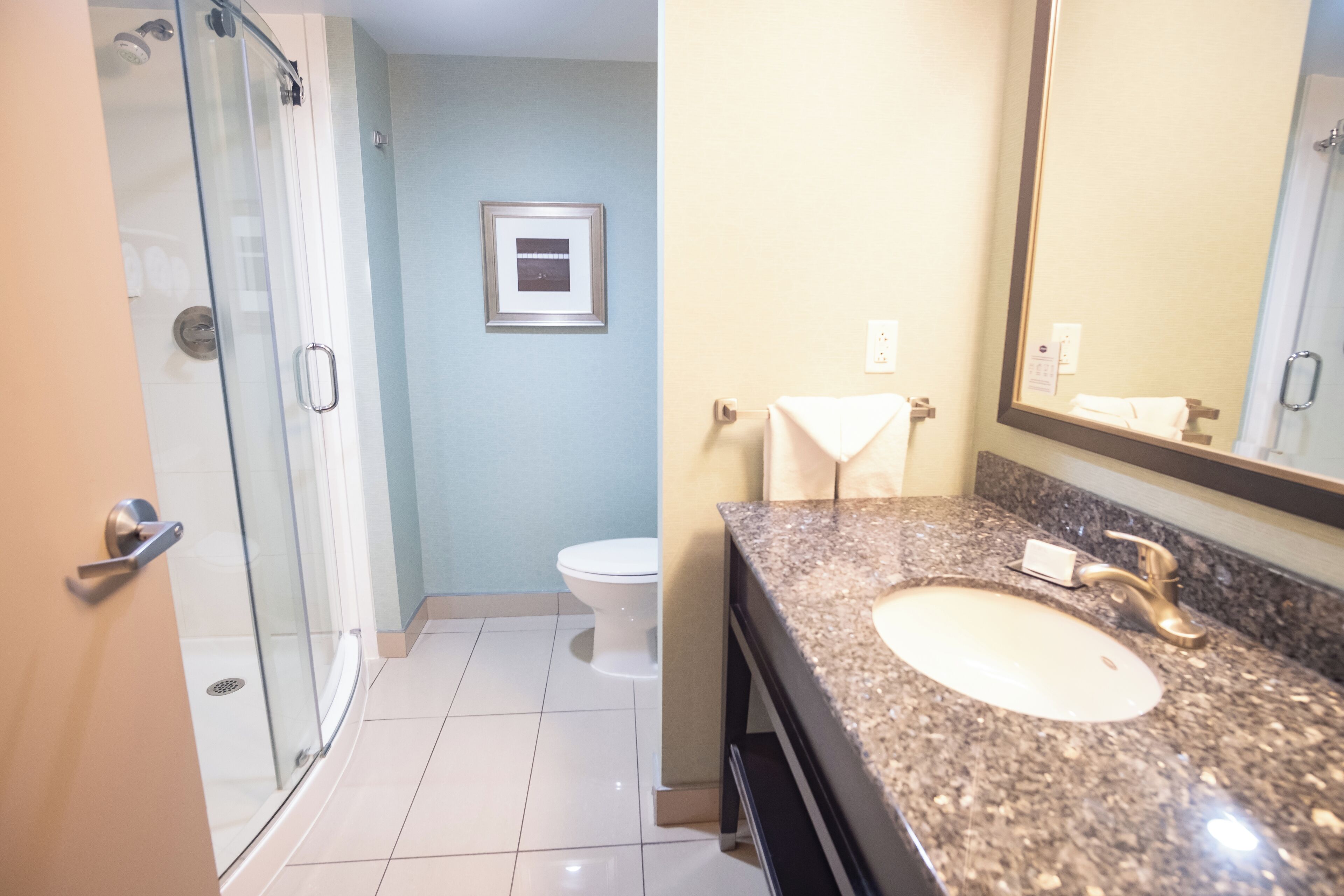 room, 1 king bed, refrigerator & microwave | bathroom | combined shower/bathtub, hair dryer, towels