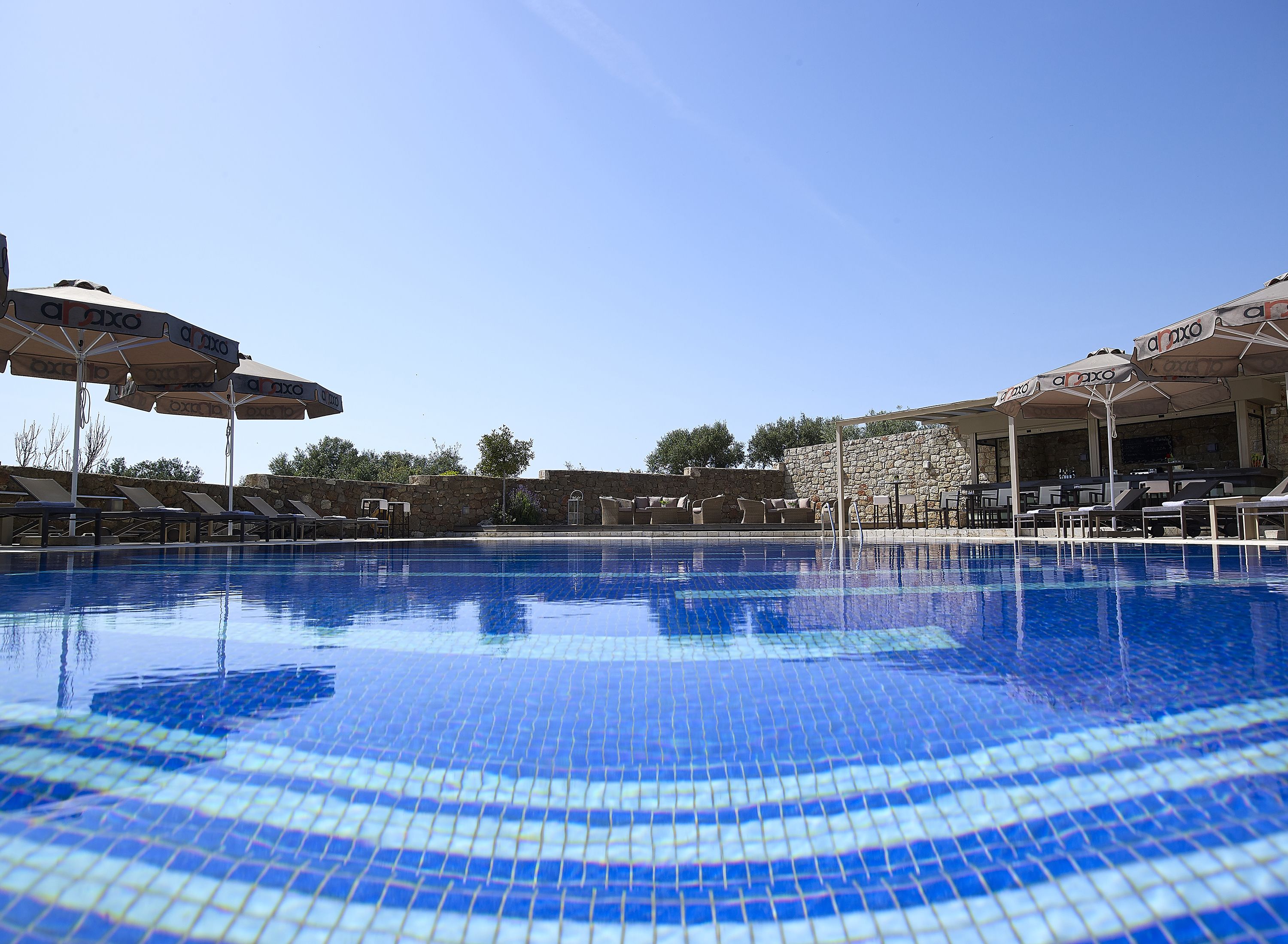 Seasonal outdoor pool, pool umbrellas, pool loungers