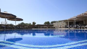 Seasonal outdoor pool, pool umbrellas, pool loungers