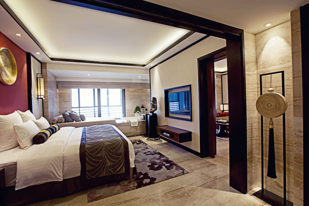 senior suite | in-room safe, desk, blackout curtains, iron/ironing board