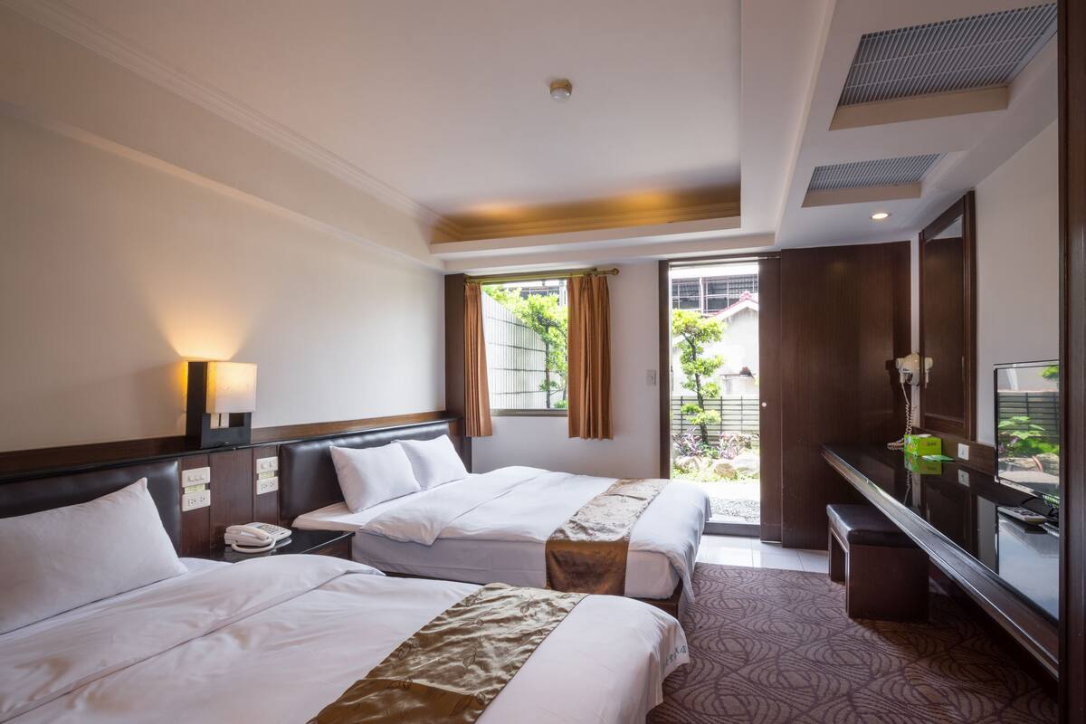 Superior Quadruple Room | Down comforters, blackout drapes, individually decorated