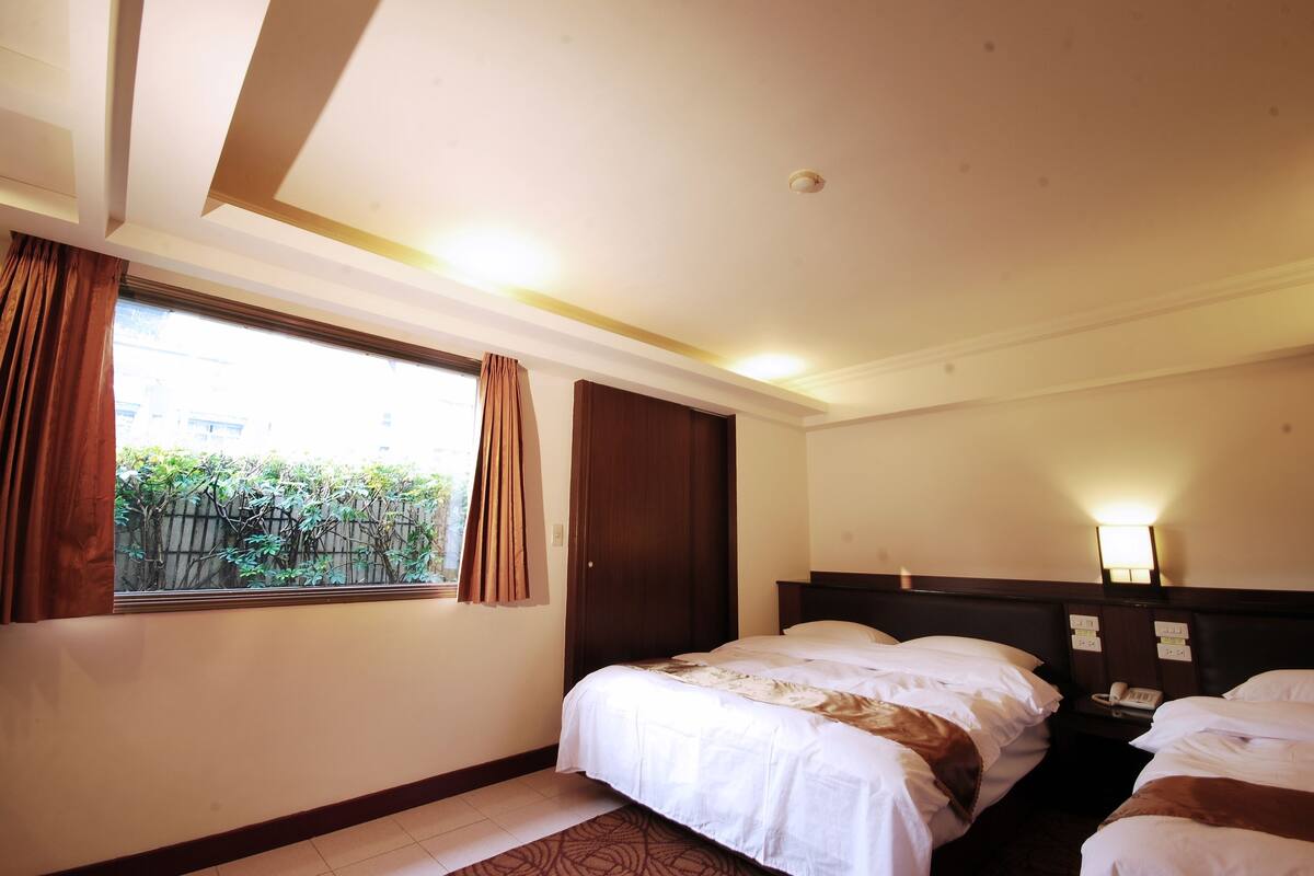 Superior Twin Room | Down comforters, blackout drapes, individually decorated