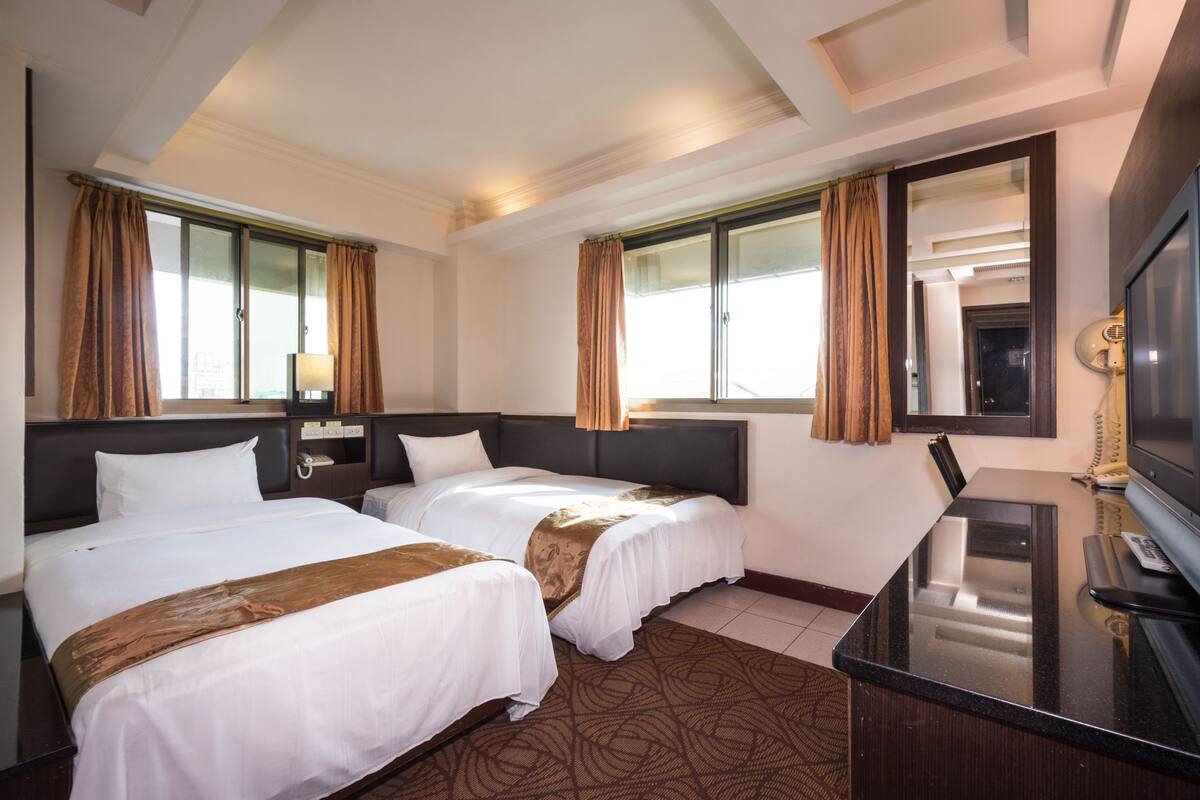 Standard Twin Room | Down comforters, blackout drapes, individually decorated