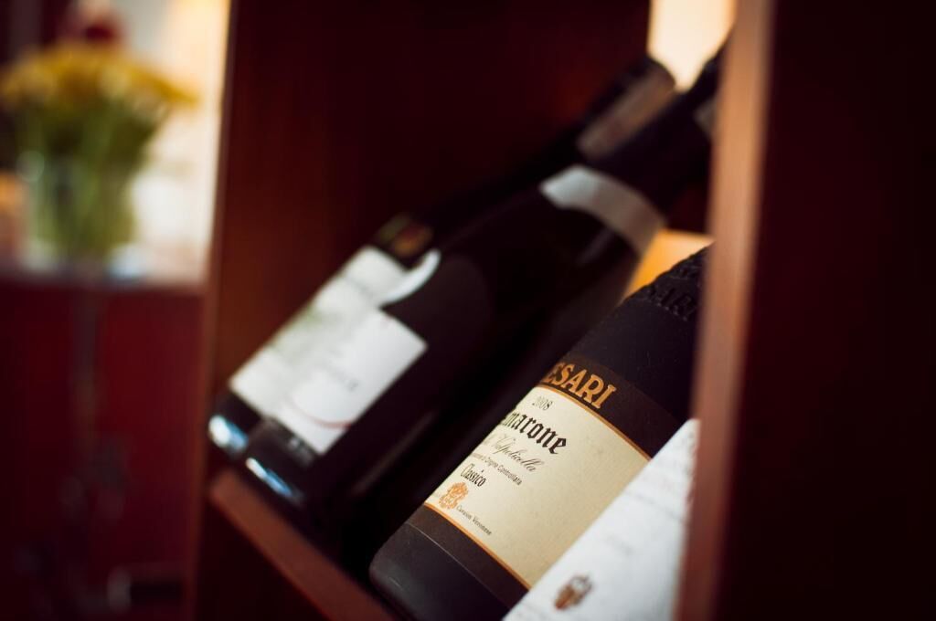 A bottle of wine with a label that includes the word 'SARI' and the year '2008'.