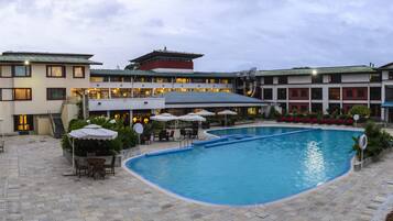 Indoor pool, outdoor pool, pool umbrellas, pool loungers