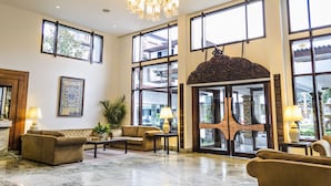 A spacious lobby with large windows, a chandelier, and a grand entrance. - Hotel Annapurna (Kathmandu)