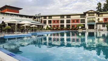 Indoor pool, outdoor pool, pool umbrellas, pool loungers