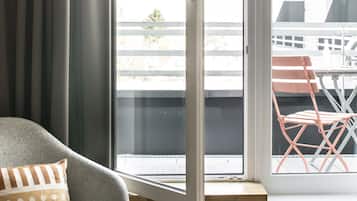 Hypo-allergenic bedding, desk, laptop workspace, blackout drapes